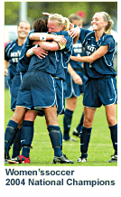 Women's soccer 2004 National Champions celebrate with a group hug.